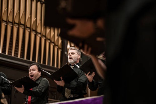 men singers in church choir during performance at concert - concert stock pictures, royalty-free photos & images