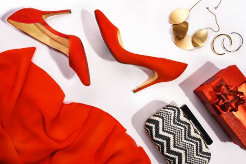 merry christmas and happy new year party concept with red shoes, make-up and beauty accessories. - fashion fotografías e imágenes de stock