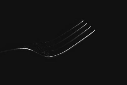 metal fork on black background - food stock pictures, royalty-free photos & images