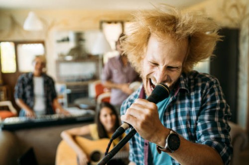 metal male singer screaming at the microphone - concert stock pictures, royalty-free photos & images