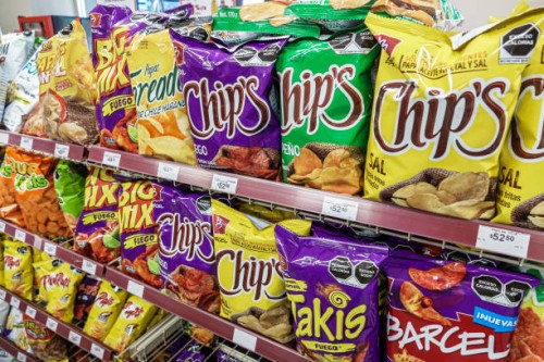 Mexico City, Mexico, Avenida Paseo de la Reforma, Oxxo snacks and chips display .