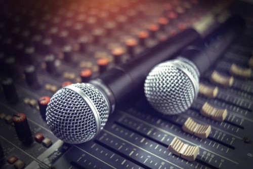 microphone over the abstract blurred on sound mixer out of focus background - concert stock pictures, royalty-free photos & images
