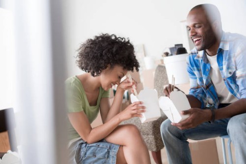 mid adult couple eating chinese take away - junk food stock pictures, royalty-free photos & images