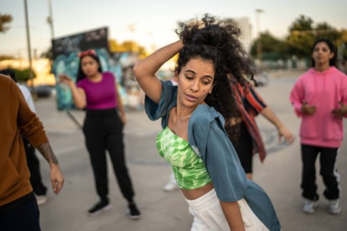 mid adult woman dancing hip hop with her friends outdoors - concert stock pictures, royalty-free photos & images