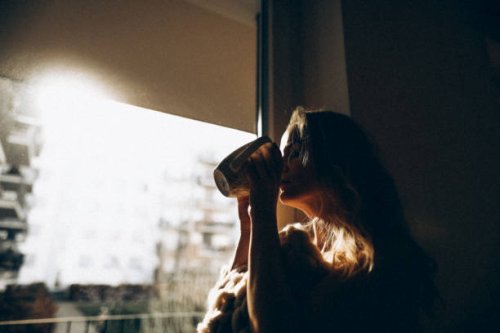 middle-aged woman enjoying her morning coffee. - coffee stock pictures, royalty-free photos & images