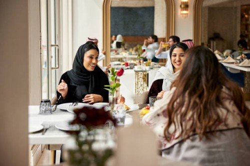 middle eastern women enjoying meal in hotel restaurant - food stock pictures, royalty-free photos & images