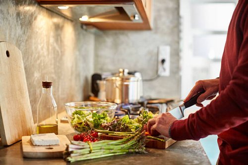 midsection of man cutting vegetables - food stock pictures, royalty-free photos & images