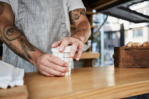 midsection of salesman packing disposable coffee cup in food truck - junk food stock pictures, royalty-free photos & images