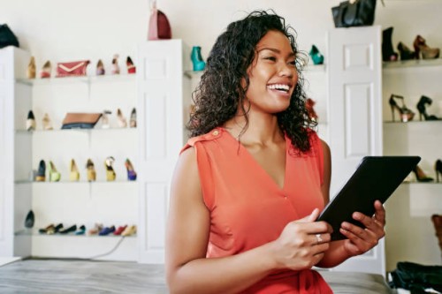 mixed race woman working in shoe store - fashion stock pictures, royalty-free photos & images