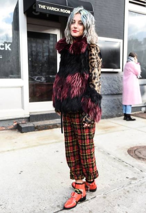 Model Chloe Norgaard is seen wearing an animal print fur coat with plaid pants outside of the 3.1 Phillip Lim show during New York Fashion Week:...