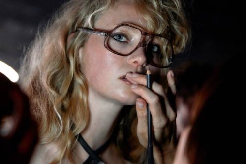 Model gets ready backstage ahead of the MASHA POPOVA Spring/Summer 2025 collection at London Fashion Week in London on September 14, 2024.