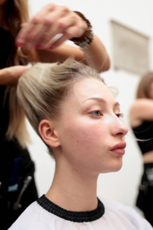 Model gets their hair styled backstage ahead of the A Journey Towards Marvel Hill: SS25 By Genaro Rivas show during London Fashion Week September...