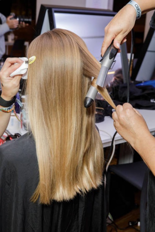 Model, hair detail, backstage ahead of the Tom Ford fashion show during the Milan Fashion Week Womenswear Spring/Summer 2024 on September 21, 2023 in...