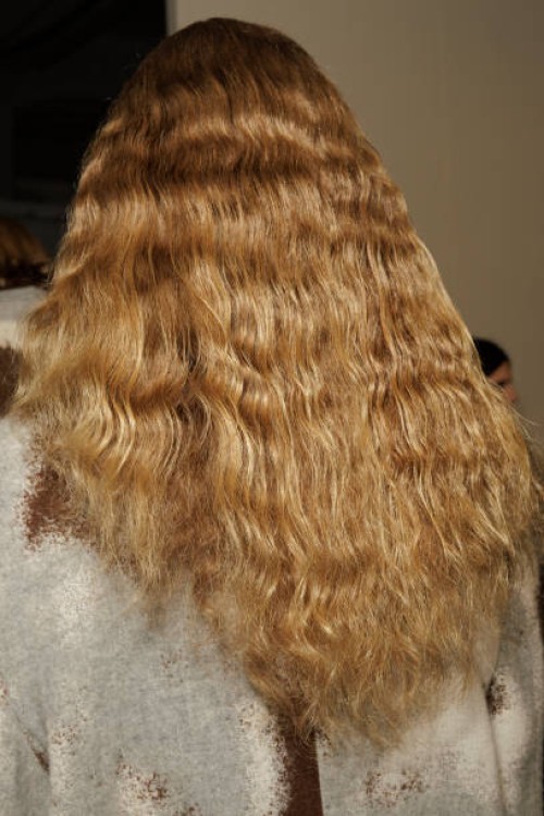 Model, hair detail is posing backstage at the Federico Cina fashion show during the Milan Menswear Fall/Winter 2024-2025 on January 13, 2024 in...