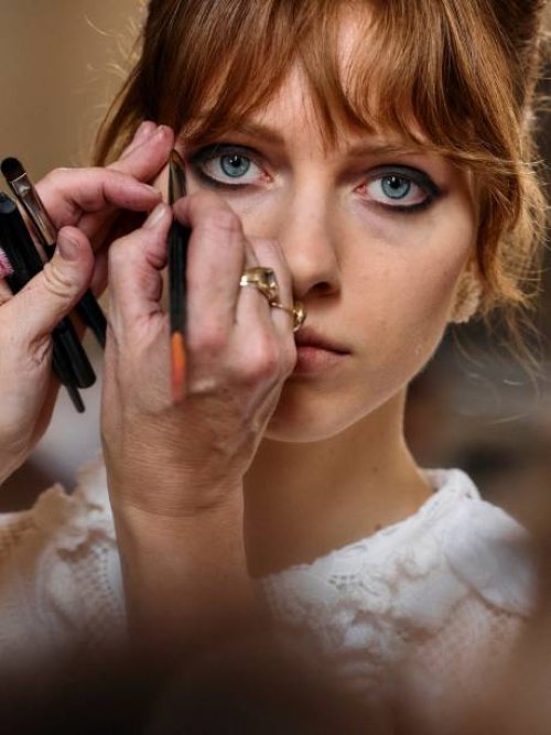 Model has hair and make up prepared backstage, ahead of the Bora Aksu Spring/Summer 2025 collection, at London Fashion Week in London, on September...