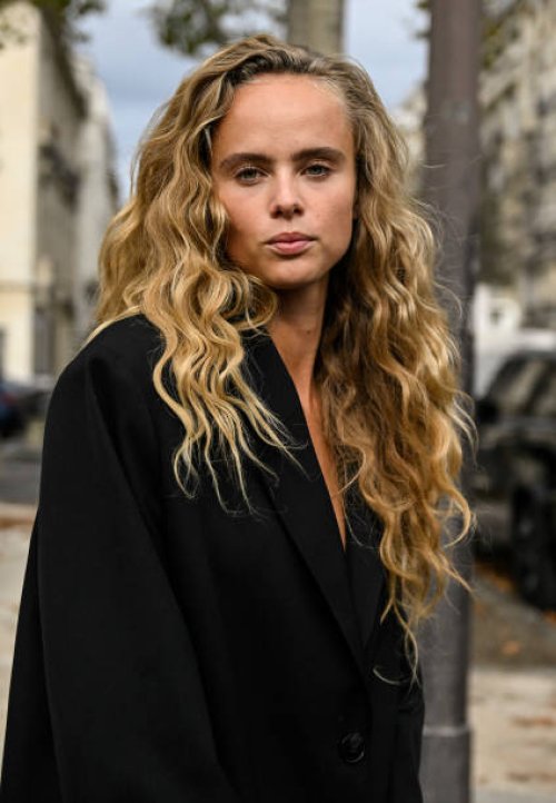 Model Olivia O. Vinten is seen wearing a black blazer outside the Chanel show during the Womenswear Spring/Summer 2024 as part of Paris Fashion Week...