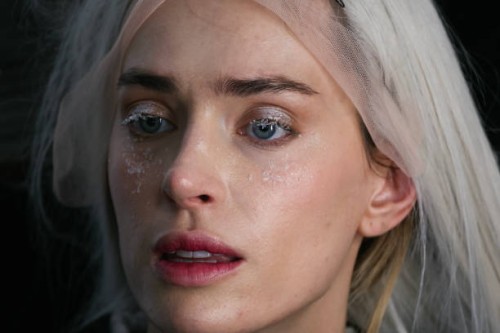 Model poses for photos in the backstage before presenting a creation by Weinsanto for the Women Ready-to-wear Fall-Winter 2025/2026 collection as...