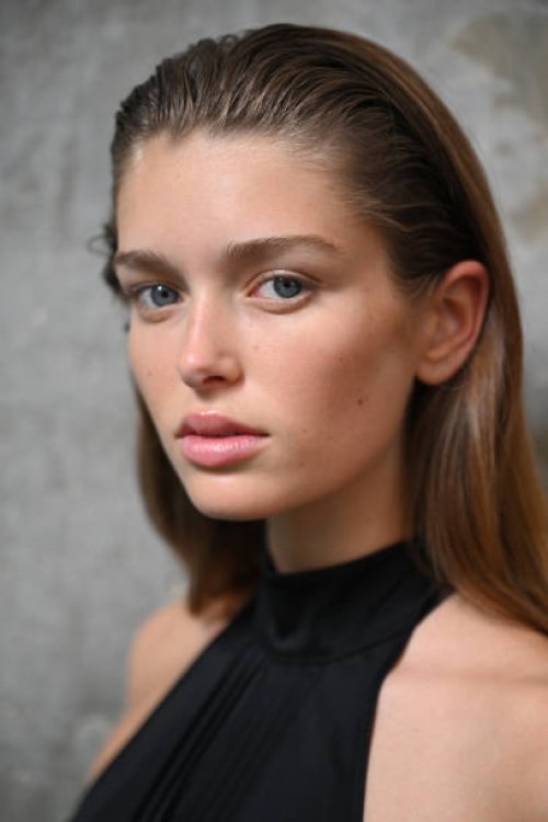 Model prepares backstage ahead of the VIKTORIA & WOODS show during Australian Fashion Week Presented By Pandora 2024 at The Cove Apartment Building,...