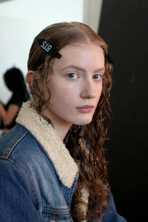 Model prepares backstage at the Juzui SS25 Collection fashion show during the September 2024 New York Fashion Week: The Shows at Canoe Studios on...