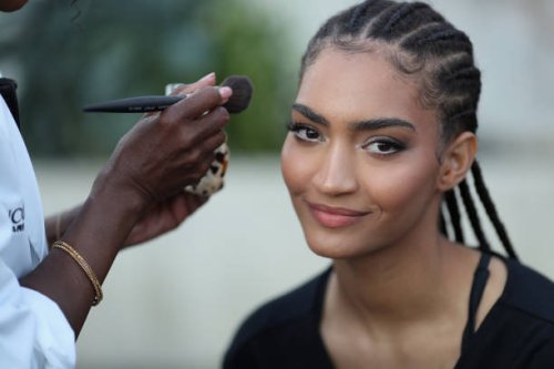 Model prepares backstage before the LaQuan Smith fashion show during the September 2024 New York Fashion Week on September 09, 2024 in New York City.