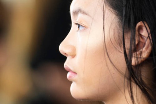 Model prepares backstage for 'Custo Barcelona' fashion show during Mercedes-Benz Madrid Fashion Week in Madrid, Spain. July 09, 2018.