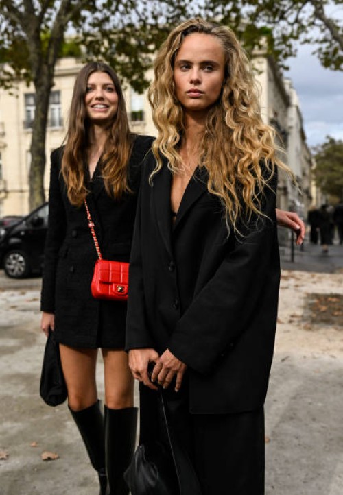 Models Mathilde Henning and Olivia O. Vinten are seen wearing black jackets outside the Chanel show during the Womenswear Spring/Summer 2024 as part...