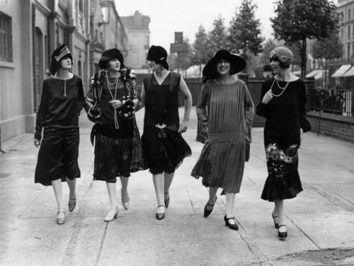 Models outside the fashion exhibition at Holland Park in London wearing comtemporary dropped waist dresses and styles of 25 years ago.