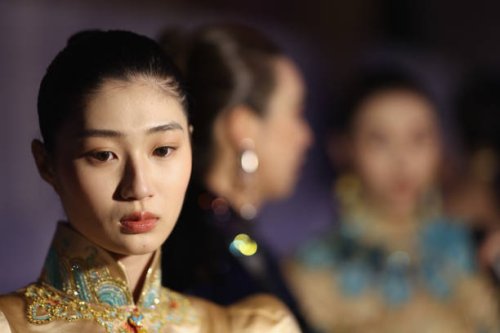 Models prepare backstage before the Loolayy collection show by Chinese designers Zhang Xiaoqi at China Fashion Week A/W 2024 on March 23, 2024 in...