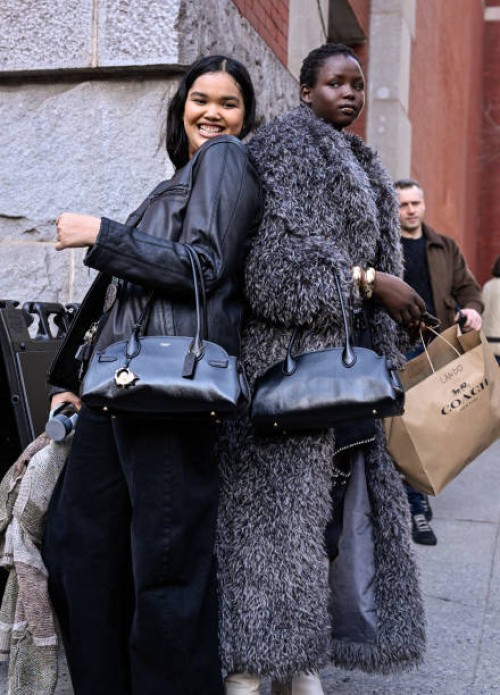 Models Shahnaz Indira and Nyandeng Makur are seenoutside the Coach show during NYFW F/W 2025 on February 10, 2025 in New York City.