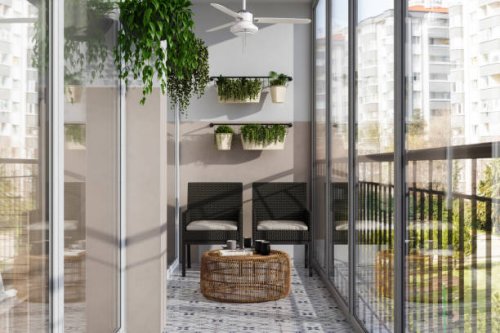 modern enclosed balcony with wicker chairs, coffee table and creeper plants - garden decoration stock pictures, royalty-free photos & images