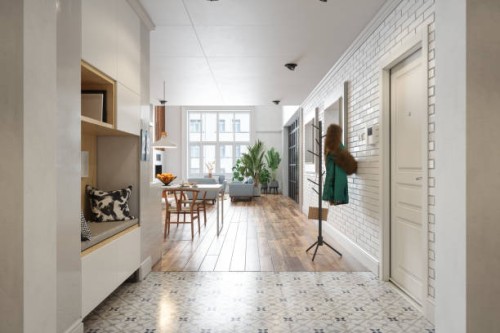 modern hallway with coat hanger, living room, dining table and houseplants - home decoration stock pictures, royalty-free photos & images