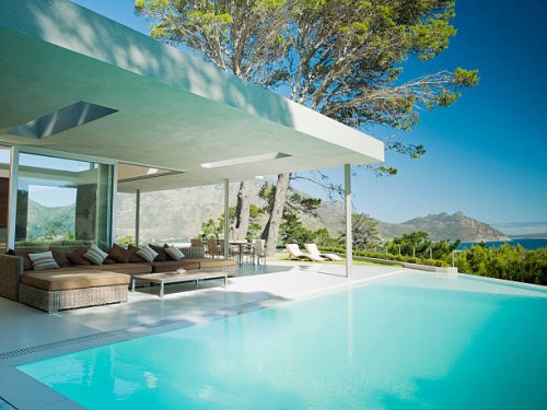 modern home, patio and infinity swimming pool - home decoration stock pictures, royalty-free photos & images