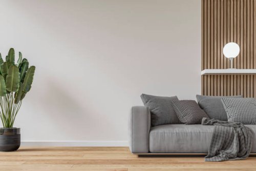 modern interior: a living room with a gray sofa, white and hardwood paneled wall background and decoration - home decoration stock pictures, royalty-free photos & images