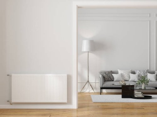 modern living room interior with radiator on blank wall, sofa, coffee table and floor lamp - home decoration stock pictures, royalty-free photos & images