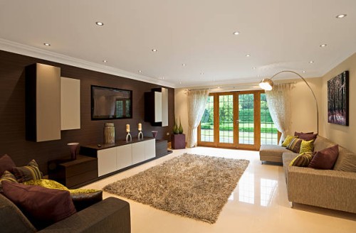 modern living room space with purple, green, and brown decor - garden decoration stock pictures, royalty-free photos & images