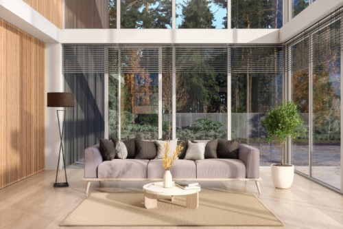 modern loft living room interior with sofa, coffee table, floor lamp and garden view from the window - garden decoration stock pictures, royalty-free photos & images