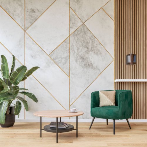 modern luxury interior: a living room with a soft green velvet armchair, low coffee table, marble white, golden and hardwood paneled wall background and decoration - home decoration stock pictures, royalty-free photos & image