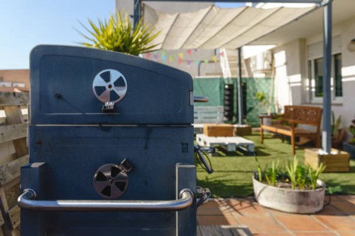 modern set of barbecue at backyard terrace in summer time - garden decoration stock pictures, royalty-free photos & images