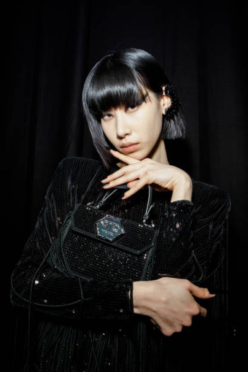 Moon poses backstage at the Philipp Plein fashion show during the Milan Fashion Week Womenswear Fall/Winter 2023/2024 on February 25, 2023 in Milan,...