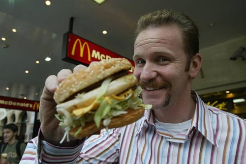 Morgan Spurlock of the documentary 'Super Size Me', where he ate only McDonald's for 30 days, shown with a Big Mac, 26 May 2004. SMH Picture by...