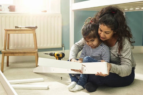 mother and daughter building furniture - home decoration stock pictures, royalty-free photos & images