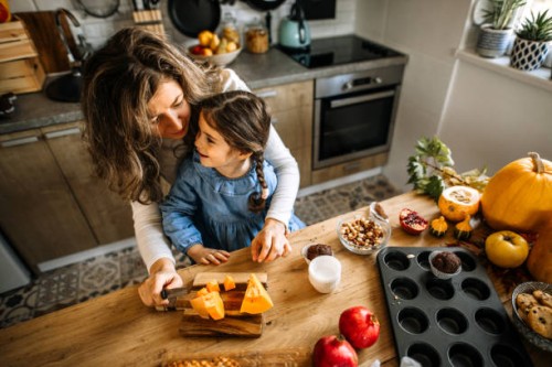 mother and daughter preparing different sweet holiday treats - home decoration stock pictures, royalty-free photos & images
