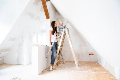 mother and son working on loft conversion - home decoration stock pictures, royalty-free photos & images
