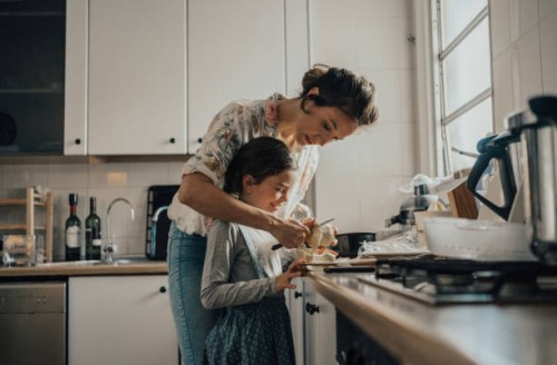 mother showing daughter how to peel an apple - food stock pictures, royalty-free photos & images