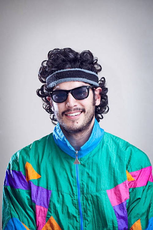 mullet man with 1980's-1990's fashion style - fashion stock pictures, royalty-free photos & images