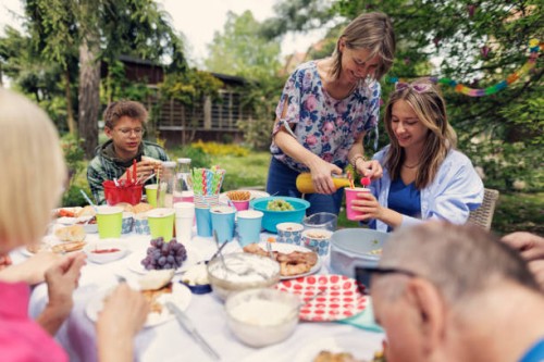 multi- generation family enjoying garden party celebration meal together - garden decoration stock pictures, royalty-free photos & images