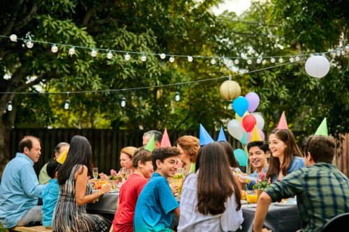 multi-generation family celebrating birthday party - garden decoration stock pictures, royalty-free photos & images