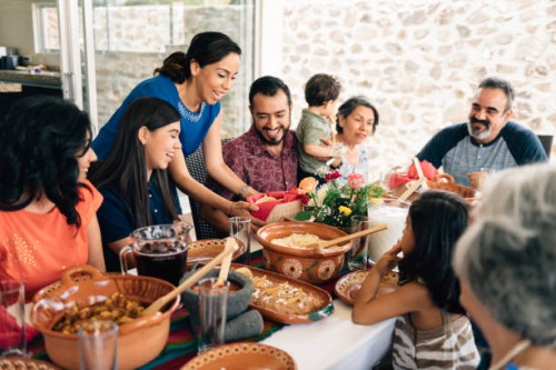 multi-generation family eating together outdoors - food stock pictures, royalty-free photos & images