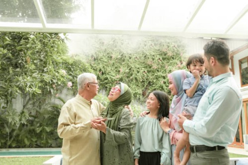 multi-generation family enjoying celebrating birthday - garden decoration stock pictures, royalty-free photos & images