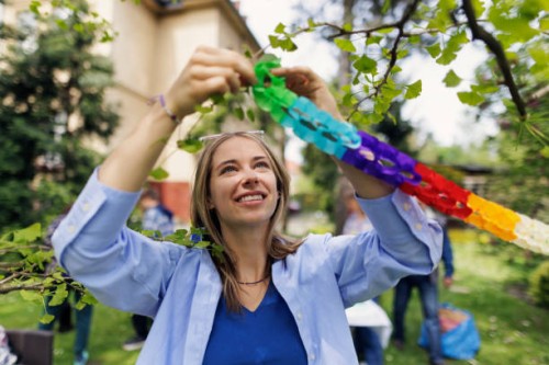 multi-generation family preparing garden party celebration - garden decoration stock pictures, royalty-free photos & images